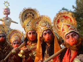 Indian Hindus dressed as deities Lord Hanuman pose during a religious procession on the grounds of Durgiana temple in Amritsar on October 24, 2012 on the occasion of the Hindu festival of Dussehra. Held at the end of the Navratri (nine nights) Festival, Dussehra symbolises the victory of good over evil in Hindu mythology. On the night of Dussehra, fire-crackers and stuffed effigies of Ravana are set alight in open grounds across the country. NARINDER NANU/AFP/Getty Images