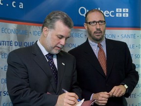 While he was Quebec health minister, Philippe Couillard (left) shown in this 2008 file photo with Liberal MLA Francois Ouimet, was kept busy dealing with crowded ERs and an overburdened medical system. But does he have the right prescription for the Quebec Liberals of 2012? (THE GAZETTE/Allen McInnis)