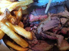 Award-winning, slow cooked brisket is served up with fries at Blackstrap BBQ (photo by Lauren Cracower)
