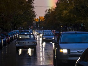 MONTREAL, QUE.: OCTOBER 20, 2012-- A rainbow is seen on the background as cars head north on St. Denis street in the neighbourhood of Villeray in Montreal on Saturday, October 20, 2012. (Dario Ayala/THE GAZETTE)