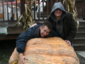 Embracing an award-winning pumpkin at a county fair. (Photo credit: www.benstarr.com)