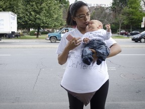 Taedra Harris and infant son at protest this summer in support of  suspended Pointe-Claire ob-gyn.