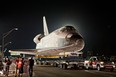 A Toyota Tundra pulls the space shuttle Endeavour across the Manchester Boulevard Bridge over Freeway 405 in Los Angeles last Friday, Oct. 12.