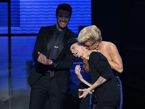 Given Justin Bieber's lack of hand to hand defence skills exhibited here with  Jenny McCarthy during the 40th Anniversary American Music Awards, it isn't surprising assault charges were not filed against him in connection with an alleged incident last month. (Photo by John Shearer/Invision/AP)
