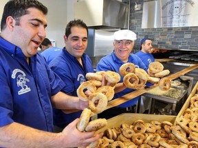 Brothers Nicolo and Vince Morena with their father Joe at their new West Island location of St. Viateur Bagel in Dollard des Ormeaux on Nov. 7.