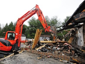 After 20 months since a fire destroyed it, Allen Bassenden's  home was finally demolished on Friday.