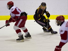 Royals defenceman Bradley Lalonde (left) covers Daniel Sprong of Tigers in recent midget espoir game in Dorval.