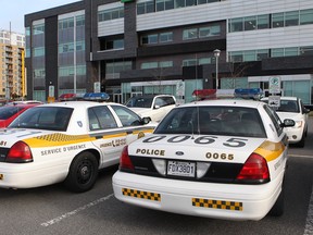 Surete du Quebec cars are parked in front of a consulting engineering company in Laval, this week during another anti-corruption squad raid on the city. (Marie-France Coallier / THE GAZETTE)