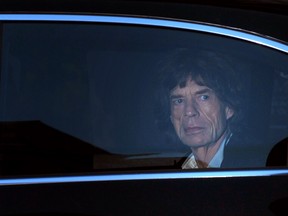 TOPSHOTS
Mick Jagger of The Rolling Stones waits to exit the car as he arrives to attend the world premier of "Crossfire Hurricane", a documentary about the legendary British rock band, in London's Leicester Square on October 18, 2012. TOPSHOTS/AFP PHOTO/CARL COURTCARL COURT/AFP/Getty Images