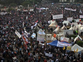 Thousands flocked to Cairo's central Tahrir square on Tuesday for a protest against Egypt's president in a significant test of whether the opposition can rally the street behind it in a confrontation aimed at forcing the Islamist leader to rescind decrees that granted him near absolute powers. Part of The Gazette's Story So Far for Nov. 27 (AP Photo/Khalil Hamra)