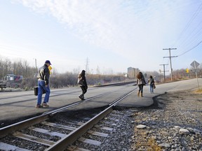 Commuters complain the train stations on Ile Perrot are dangerous because they must cross at a level crossing to access the westbound track.