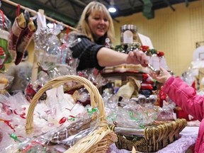 Natalie Rossy of Le Bouquet Blanc gave free candy to the children of clients of her holiday treats booth.