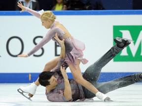 Russia's Tatiana Volosozhar and Maxim Trankov falls on ice as they perform during their pairs free skating at the ISU Grand Prix of Figure Skating Final in Sochi on December 8, 2012.