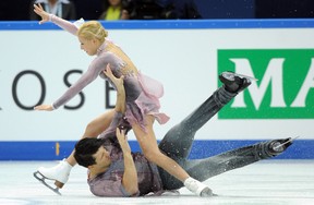 Russia's Tatiana Volosozhar and Maxim Trankov falls on ice as they perform during their pairs free skating at the ISU Grand Prix of Figure Skating Final in Sochi on December 8, 2012.