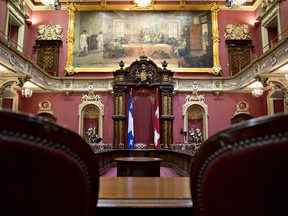 The Canadian flag will remain in the Red Room of the Quebec National Assembly after the matter was put to a vote on Tuesday. The PQ government had decided to pull the flag out from the room after their election. THE CANADIAN PRESS/Jacques Boissinot