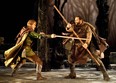 Robin Good (played by Eric Davis) and Little John (Matthew Kabwe) battle it out in Sherwood Forest in Geordie Productions' full-scale mainstage production of Robin Hood playing at the Centaur Theatre in Old Montreal until Dec 16 (Photo by  David Babcock, courtesy Geordie Productions)