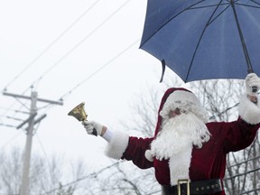 Santa Claus had to add an umbrella to his usual holiday getup, but rain didn't dampen the holiday spirit.