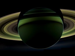 In this image provided by NASA Tuesday Dec. 18, 2012 NASA's Cassini spacecraft has delivered a glorious view of Saturn, taken while the spacecraft was in Saturn's shadow. The cameras were turned toward Saturn and the sun so that the planet and rings are backlit. In addition to the visual splendor, this special, very-high-phase viewing geometry lets scientists study ring and atmosphere phenomena not easily seen at a lower phase. (AP Photo/NASA)