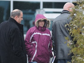 ** POSTMEDIA USE ONLY ** Sonia Blanchette, pictured in December 2011 in Drummondville after her arrest in another incident,  is a 33-year-old divorcee who lost custody of her three young children and allegedly kidnapped one of them is now considered an important witness in their deaths on Sunday. The grandmother found the bodies of Laurelie, 5, Loic, 4, and Anais, 2, in a top-floor apartment in Drummondville, east of Montreal on Sunday. Blanchette, who had lost a 2 1/2-year custody battle, was taken to hospital in shock. (Ghyslain Bergeron / Special to Postmedia News)    **