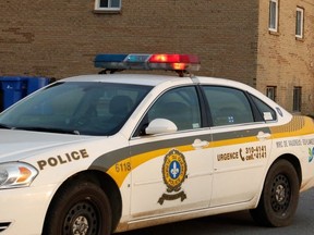 Surete du Quebec police stand guard at the scene of an October shooting in  Vaudreuil-Dorion: area towns say there is no relation between what they pay for police services and what they get.