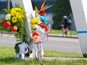 Flowers in honour of STM bus driver Sylvain Ferland were left at the site of a fatal collision last August between the bus he was driving and a car at the corner of 55th ave. and Lindsay St. in Dorval, west of Montreal. In addition to the bus driver, a passenger in the car also died in the accident. Charges have been filed against the driver of the car that struck the bus.          (John Mahoney/THE GAZETTE)