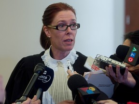 Crown prosecutor Marie-Claude Bourassa speaks to reporters following the court appearance of a 12-year-old boy charged in the shooting death of his 16-year-old brother  on the evening of Monday January 21. (Pierre Obendrauf / THE GAZETTE)