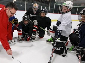 Roberto Gomez draws on the ice during a practice with his novice B Civics.