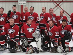 The Grey Hawks old-timer hockey team. Todd France is No. 19, Gary Hollister is the goalie and Chris Ebsworth stands next to the coach. Photo courtesy of Gary Hollister.