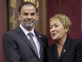 Quebec Premier Pauline Marois poses with Minister for Higher Education Pierre Duchesne as she introduced members of her cabinet during a ceremony last September. Will Marois and Duchesne be in for a rough ride this spring now that  the PQ's admitted Quebec can't afford free university tuition? THE CANADIAN PRESS/Jacques Boissinot