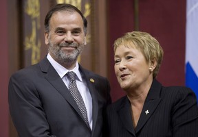 Quebec Premier Pauline Marois poses with Minister for Higher Education Pierre Duchesne as she introduced members of her cabinet during a ceremony last September. Will Marois and Duchesne be in for a rough ride this spring now that  the PQ's admitted Quebec can't afford free university tuition? THE CANADIAN PRESS/Jacques Boissinot