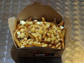 Poutine: It may not be the prettiest thing you'll ever eat, but at least you know you're not getting anything more than french fries, squeaky cheese and gravy. But is this classic ready for foie gras, Stilton cheese or, God help us, flower petals on the sauce?(Aaron Harris / SPECIAL TO THE GAZETTE)