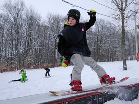 Nathaniel Campo-Vachon, 14, took advantage of the fresh snow to practice new tricks with his snowboard.