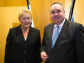A handout picture released by the Quebec Department of International Relations and Foreign Trade shows Scottish First Minister Alex Salmond posing for a photograph with Quebec premier Pauline Marois during a meeting at the Scottish Parliament in Edinburgh, Scotland. A referendum on Scottish independence is scheduled for next year. AFP Photo / Patrick Lachance