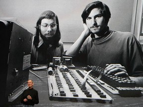 Apple Inc. CEO Steve Jobs speaks during an Apple Special Event at Yerba Buena Center for the Arts January 27, 2010 in San Francisco, California. He introduced Apple's latest creation, the iPad. A much younger Jobs can be seen in the image on  the screen behind him.  (Jobs is on the right, with him is Apple co-founder Steve Wozniak.)  (Justin Sullivan/Getty Images)