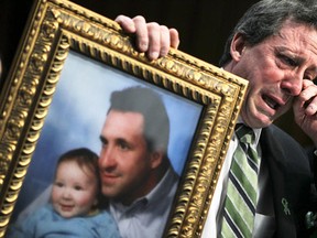 WASHINGTON, DC - FEBRUARY 27:  Neil Heslin, father of six-year-old Sandy Hook Elementary School shooting victim Jesse Lewis, wipes tears as he testifies during a hearing before the Senate Judiciary Committee February 27, 2013 on Capitol Hill in Washington, DC. The committee held a hearing on "The Assault Weapons Ban of 2013."  (Photo by Alex Wong/Getty Images)  *** BESTPIX *** ORG XMIT: 151401068