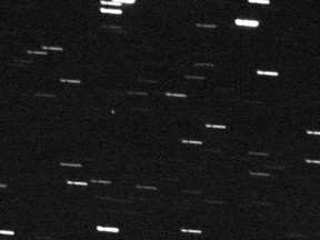 LET THE WEEKEND BEGIN AS SCHEDULED! This image courtesy of NASA shows asteroid 2012 DA14 (the white dot in the middle of picture)  taken by the FRAM Telescope in Argentina, part of the GLObal Robotic-telescopes Intelligent Array (GLORIA) project, in advance of its close - but safe - approach to Earth. AFP PHOTO / NASA/GLORIA project/FRAM