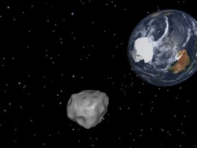 This image provided by NASA/JPL-Caltech shows a simulation of asteroid 2012 DA14 approaching from the south as it passes through the Earth-moon system on Feb. 15, 2013. The day will come when we'll be able to destroy such asteroids if they threatened Earth. But today isn't that day. THE CANADIAN PRESS/AP-NASA/JPL-Caltech