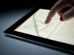 A digital book is displayed on an Apple iPad.