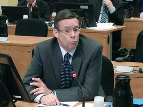 Former head of city of Montreal public works Robert Marcil testifies before the Charbonneau Commission in Montreal. At one point during his testimony, an exasperated commission president France Charbonneau asked Marcil if he was an "incompetent imbecile." (Charbonneau Commission)