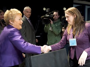 Happier days: Quebec Premier Pauline Marois, left, shakes hands with student leader Martine Desjardins prior to yesterday's opening of the education summit. By the time the day was out, Marois had made it clear that tuition will not be frozen but raised by three per cent. THE CANADIAN PRESS/Paul Chiasson