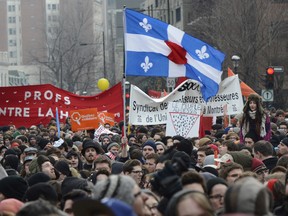 Protesters march during a demonstration by students in Montreal in the wake of Quebec's summit on higher education. While Premier Marois declared the student crisis settled, there was little to suggest so during the march. THE CANADIAN PRESS/Ryan Remiorz