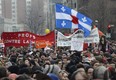 Protesters march during a demonstration by students in Montreal in the wake of Quebec's summit on higher education. While Premier Marois declared the student crisis settled, there was little to suggest so during the march. THE CANADIAN PRESS/Ryan Remiorz