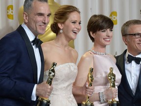 (L-R): Best Actor Daniel Day Lewis stands with Best Actress  Jennifer Lawrence, Best Supporting Actress Anne Hathaway, and Best Supporting Actor Christoph Waltz  during the 85th  Academy Awards on February 24, 2013 in Hollywood, California.   (JOE KLAMAR/AFP/Getty Images)