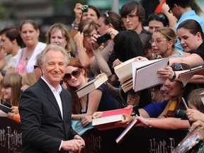 Alan Rickman signs autographs for his enthusiastic fans at the North American premiere of  Harry Potter and the Deathly Hallows – Part 2, July 11, 2011 at Lincoln Center in New York. (STAN HONDA/AFP/Getty Images)