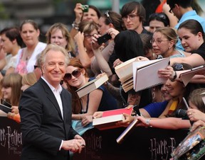 Alan Rickman signs autographs for his enthusiastic fans at the North American premiere of  Harry Potter and the Deathly Hallows – Part 2, July 11, 2011 at Lincoln Center in New York. (STAN HONDA/AFP/Getty Images)