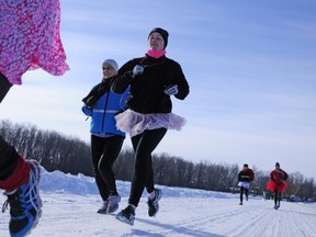 Members of the Hudson, Phoenix and Ile Bizard running groups make their way across the Ice Bridge.