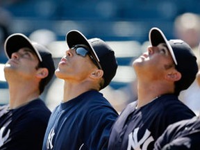 New York Yankees' Kyle Higashioka, from left, Francisco Cervelli, Joe Girardi, Bobby Wilson and J.R. Murphy follow a pop up during a workout at baseball spring training, Wednesday, Feb. 20, 2013, in Tampa, Fla. (AP Photo/Matt Slocum) ORG XMIT: FLMS104