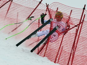 Austria's Klaus Kroell crashes during the Men Super G at the Alpine ski World Cup finals on March 14, 2013 in Lenzerheide.