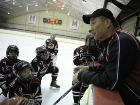 Brad Chin discusses strategy during a break in the action.