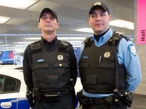 What began a month ago as a publicity campaign to show how Montreal was bringing its uniforms in line with the darker models used elsewhere in Canada has now become a protest tactic. The newer, darker uniform will be worn on officers still working a soon to be ended three-day work schedule while the paler shirt on the left will be worn by those returning to the original, less popular work shifts. (John Kenney / THE GAZETTE)